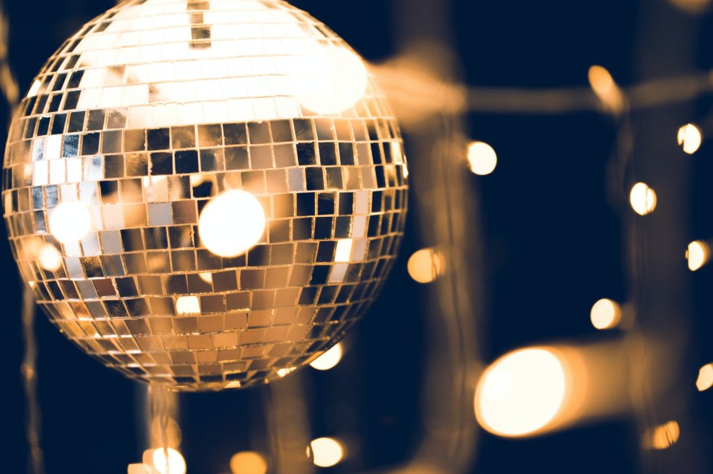 glossy disco ball with beautiful garland on foreground